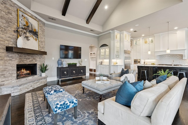 1800 Aspen St, Prosper, TX 75078 - living area with high vaulted ceiling, arched walkways, recessed lighting, beam ceiling, and dark wood-style floors