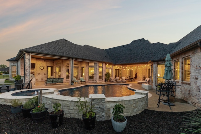 1800 Aspen St, Prosper, TX 75078 - pool at dusk with a fire pit, a patio, and a pool with connected hot tub