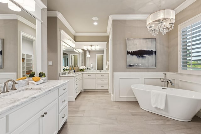 1800 Aspen St, Prosper, TX 75078 - full bath featuring a chandelier, ornamental molding, a decorative wall, two vanities, and a freestanding bath
