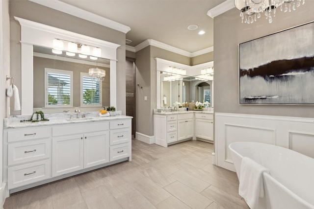 1800 Aspen St, Prosper, TX 75078 - full bathroom featuring a chandelier, ornamental molding, two vanities, a soaking tub, and recessed lighting