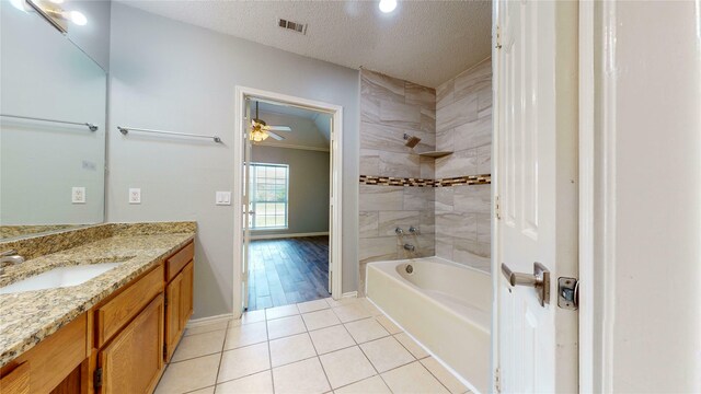 328 Antietam Way, Mesquite, TX 75149 - bathroom with vanity, tile patterned flooring, bathing tub / shower combination, a ceiling fan, and a textured ceiling