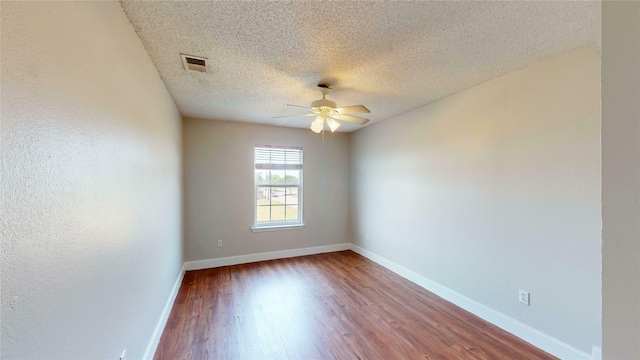 328 Antietam Way, Mesquite, TX 75149 - spare room featuring a ceiling fan, wood finished floors, and a textured ceiling