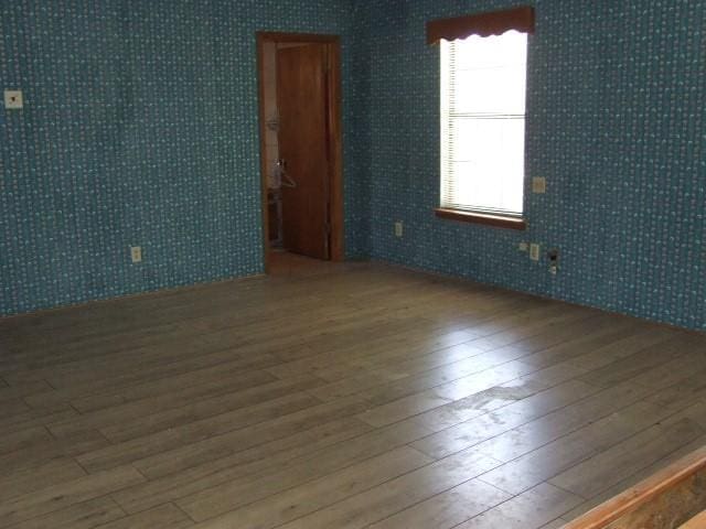 1729 Lindy Ln, Irving, TX 75060 - spare room featuring hardwood / wood-style flooring