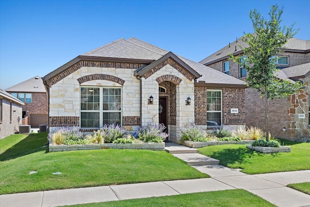 1512 Bennington Ln, Celina, TX 75009 - view of front of property with stone siding, a front lawn, and brick siding