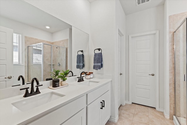 1512 Bennington Ln, Celina, TX 75009 - bathroom featuring double vanity, a shower stall, and tile patterned flooring