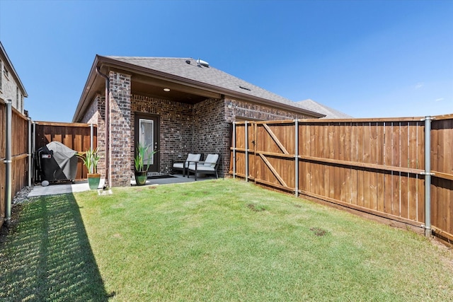 1512 Bennington Ln, Celina, TX 75009 - rear view of house featuring a fenced backyard, a shingled roof, brick siding, and a patio area