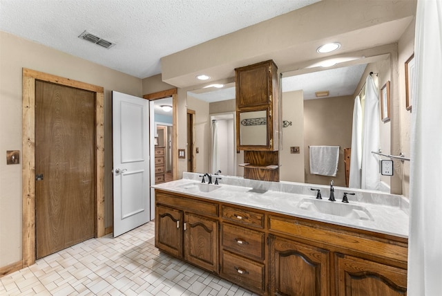 4610 County Road 862, Mckinney, TX 75071 - full bath featuring double vanity, tile patterned floors, and recessed lighting