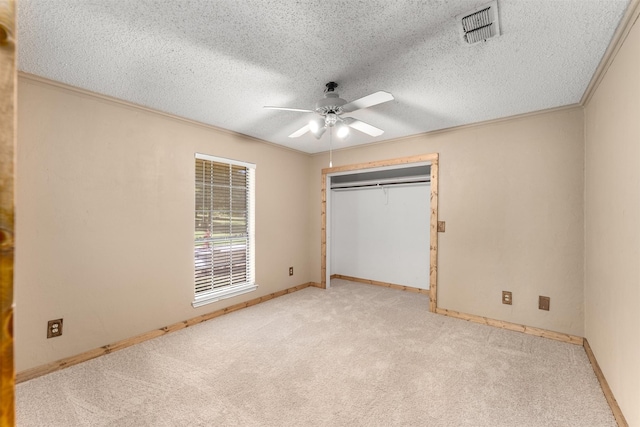 4610 County Road 862, Mckinney, TX 75071 - unfurnished bedroom featuring a textured ceiling, light colored carpet, ornamental molding, a ceiling fan, and a closet