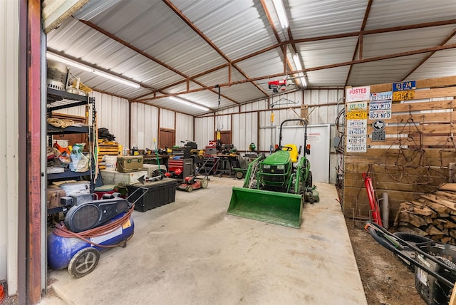 4610 County Road 862, Mckinney, TX 75071 - garage with metal wall, a garage door opener, and a workshop area