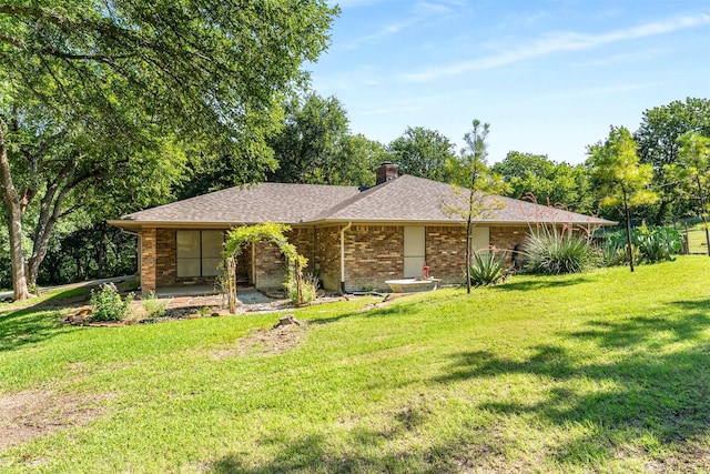 4610 County Road 862, Mckinney, TX 75071 - ranch-style home with brick siding, a chimney, a front yard, and a shingled roof