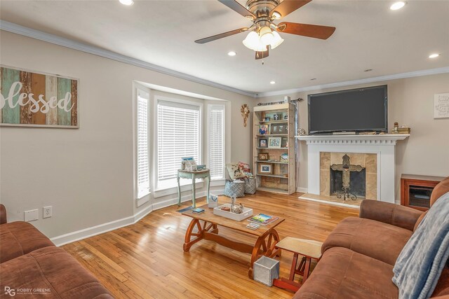 171 Albert Ave, Shreveport, LA 71105 - living area featuring ornamental molding, a tile fireplace, recessed lighting, wood-type flooring, and a ceiling fan