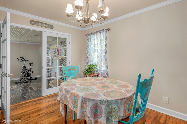 171 Albert Ave, Shreveport, LA 71105 - dining room featuring a chandelier, wood-type flooring, and ornamental molding