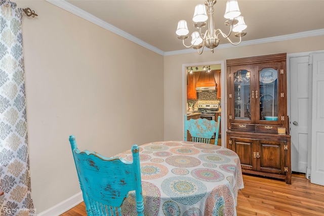 171 Albert Ave, Shreveport, LA 71105 - dining area featuring a chandelier, light wood-style flooring, and ornamental molding