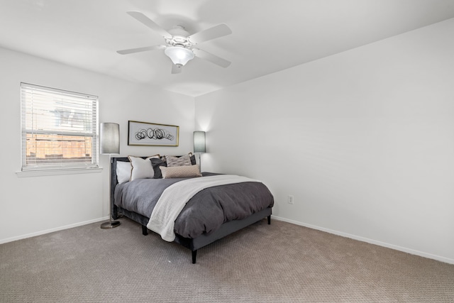 10305 Robindale Dr, Dallas, TX 75238 - carpeted bedroom with baseboards and a ceiling fan