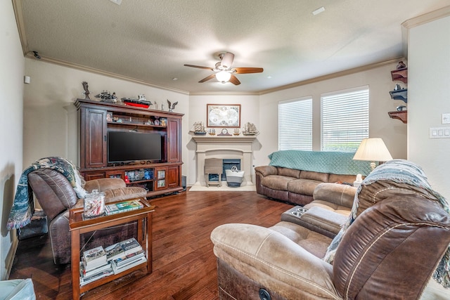 2705 Albatross Ln, Fort Worth, TX 76177 - living room featuring a ceiling fan, crown molding, dark wood-style floors, and a fireplace