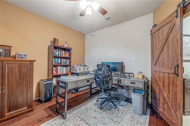 2705 Albatross Ln, Fort Worth, TX 76177 - office space with a barn door, wood finished floors, and a ceiling fan