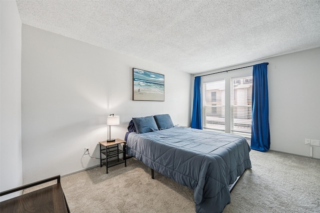 6050 Melody Ln Unit 107, Dallas, TX 75231 - carpeted bedroom featuring a textured ceiling