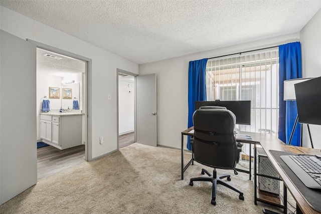 6050 Melody Ln Unit 107, Dallas, TX 75231 - carpeted home office featuring a textured ceiling