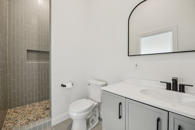 307 Misty Ln, Argyle, TX 76226 - bathroom featuring vanity, tiled shower, and tile patterned flooring