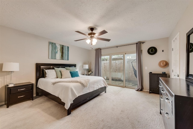 640 Silverstone Dr, Richardson, TX 75080 - bedroom with access to exterior, light carpet, a textured ceiling, and ceiling fan