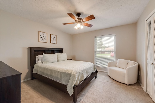 640 Silverstone Dr, Richardson, TX 75080 - bedroom featuring light carpet, ceiling fan, and a closet