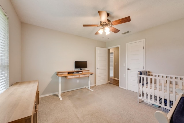 640 Silverstone Dr, Richardson, TX 75080 - carpeted bedroom with an office area and a ceiling fan