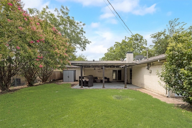 640 Silverstone Dr, Richardson, TX 75080 - rear view of property with a shed, a chimney, a patio area, brick siding, and a fenced backyard