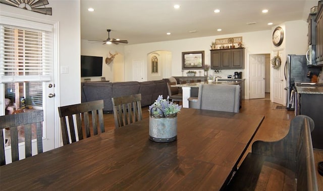 219 Spruce Valley Dr, Justin, TX 76247 - dining space with a ceiling fan, arched walkways, dark wood-style flooring, and recessed lighting