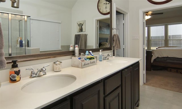 219 Spruce Valley Dr, Justin, TX 76247 - ensuite bathroom featuring ceiling fan, double vanity, tile patterned flooring, and a shower stall