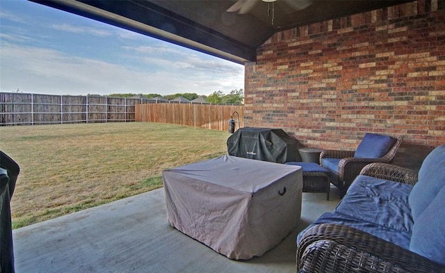 219 Spruce Valley Dr, Justin, TX 76247 - fenced backyard featuring a ceiling fan, area for grilling, and a patio area