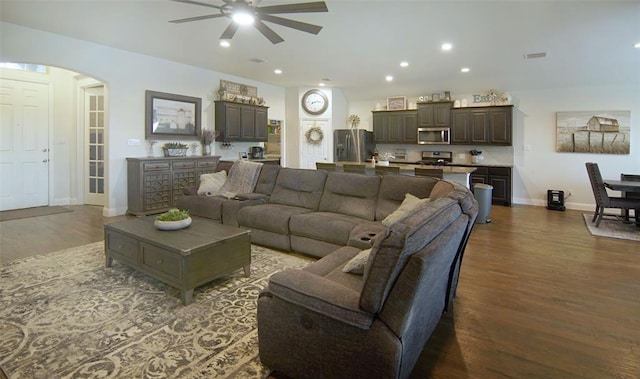 219 Spruce Valley Dr, Justin, TX 76247 - living area with arched walkways, a ceiling fan, dark wood finished floors, and recessed lighting