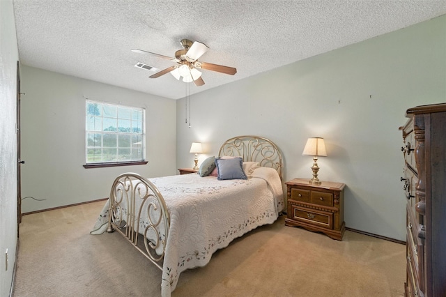 7220 Tucker Dr, Weatherford, TX 76085 - bedroom featuring carpet, ceiling fan, and a textured ceiling