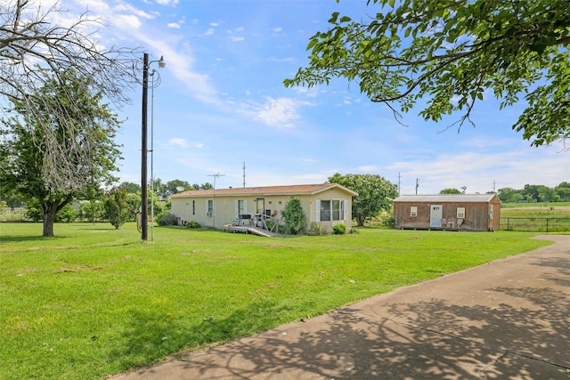 7220 Tucker Dr, Weatherford, TX 76085 - view of yard featuring an outbuilding