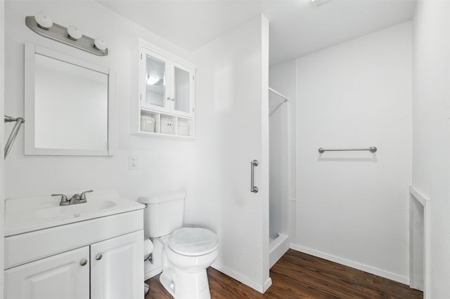 7220 Tucker Dr, Weatherford, TX 76085 - full bath featuring wood finished floors, a stall shower, and vanity