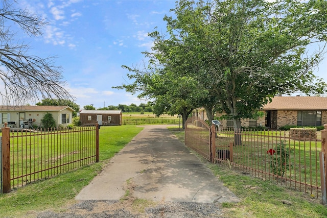 7220 Tucker Dr, Weatherford, TX 76085 - view of asphalt driveway featuring a gated entry
