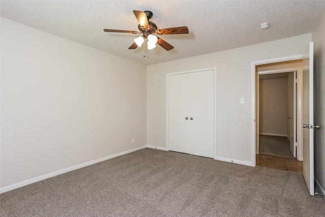 1209 Pin Oak Dr, Denton, TX 76209 - unfurnished bedroom with carpet flooring, a closet, a ceiling fan, and a textured ceiling