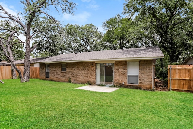 1209 Pin Oak Dr, Denton, TX 76209 - rear view of property featuring brick siding, a patio area, and roof with shingles