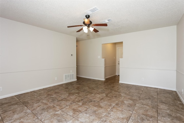 1209 Pin Oak Dr, Denton, TX 76209 - unfurnished room with ceiling fan and a textured ceiling