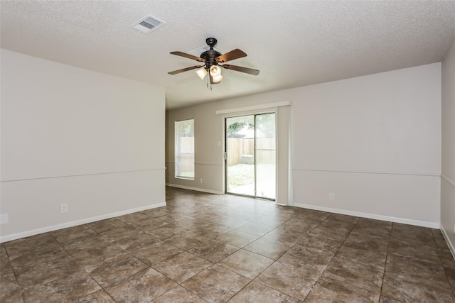 1209 Pin Oak Dr, Denton, TX 76209 - spare room featuring ceiling fan and a textured ceiling