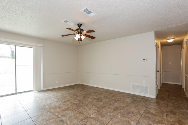1209 Pin Oak Dr, Denton, TX 76209 - tiled spare room with a textured ceiling and ceiling fan
