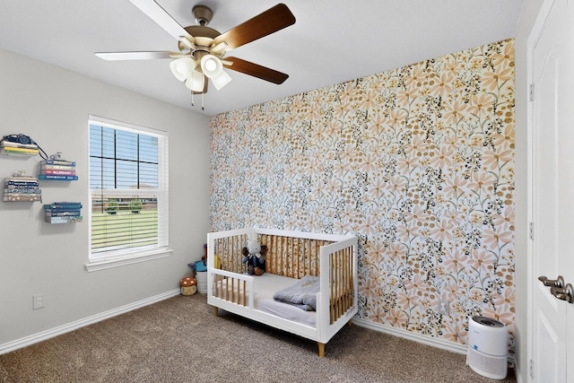 1848 Indigo Ln, Forney, TX 75126 - bedroom featuring a crib, carpet, wallpapered walls, and a ceiling fan