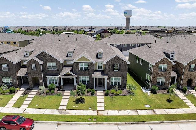 1848 Indigo Ln, Forney, TX 75126 - view of front of house featuring a residential view, brick siding, and a front lawn