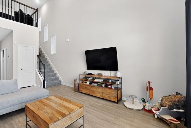 1848 Indigo Ln, Forney, TX 75126 - living area with stairs, wood finished floors, and a high ceiling
