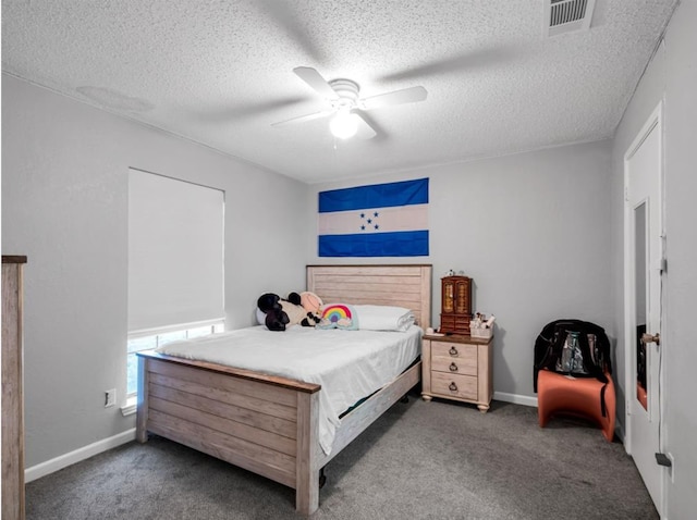1013 Huntersglen Dr, Mesquite, TX 75150 - carpeted bedroom featuring a textured ceiling and ceiling fan