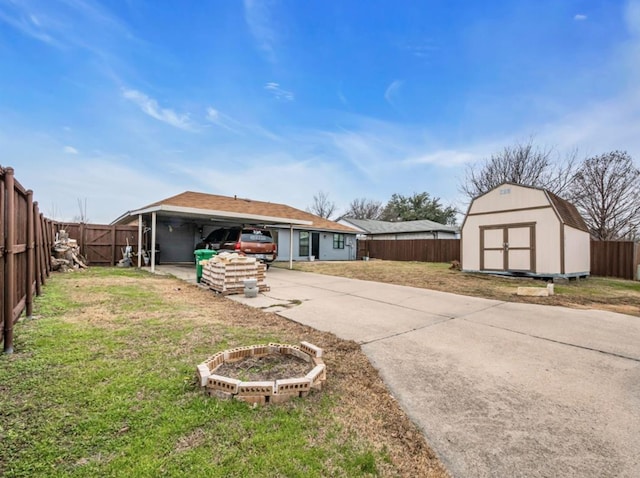 1013 Huntersglen Dr, Mesquite, TX 75150 - view of front of property featuring concrete driveway, a shed, and a fenced backyard