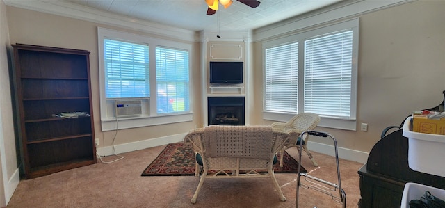 108 S Bonham St, Mexia, TX 76667 - living area featuring cooling unit, a ceiling fan, carpet, a fireplace, and ornamental molding