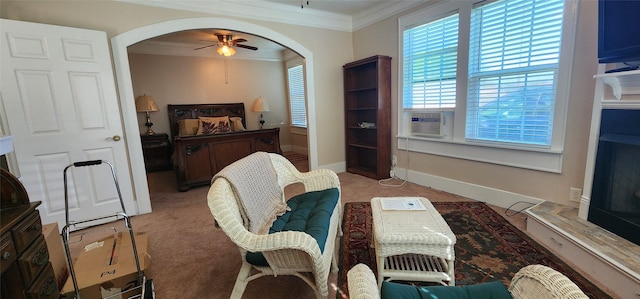 108 S Bonham St, Mexia, TX 76667 - sitting room with crown molding, arched walkways, cooling unit, ceiling fan, and light carpet