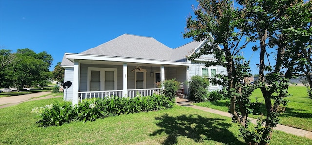 108 S Bonham St, Mexia, TX 76667 - view of front of home with covered porch, a front lawn, and roof with shingles