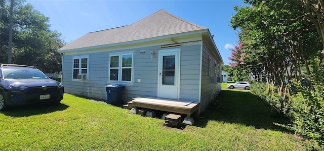 108 S Bonham St, Mexia, TX 76667 - view of side of property with a lawn and a shingled roof