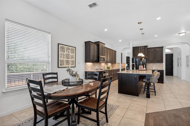 14800 Star Creek Dr, Aledo, TX 76008 - dining space featuring arched walkways, light tile patterned floors, and recessed lighting